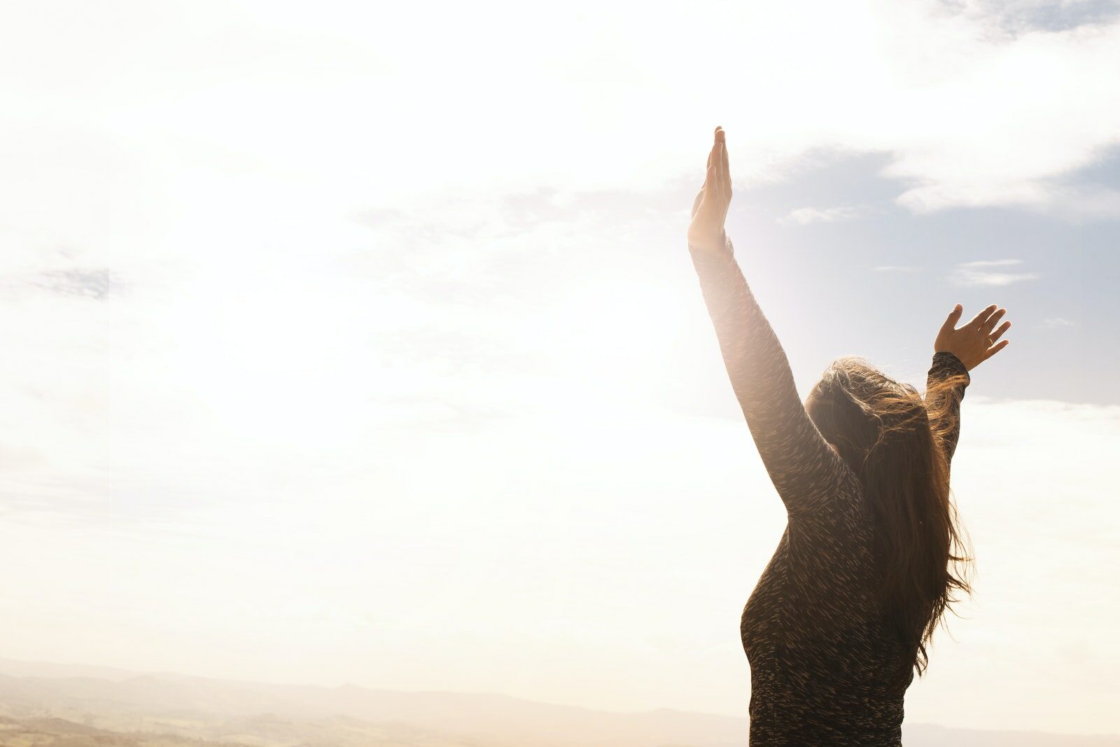 Photo of Woman Raising Both Hands