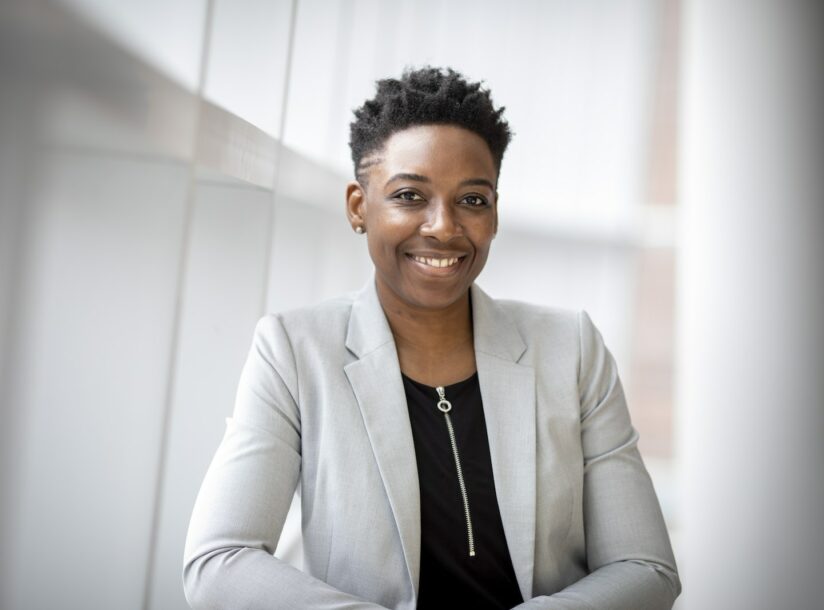 Woman Wearing Gray Notch Lapel Suit Jacket