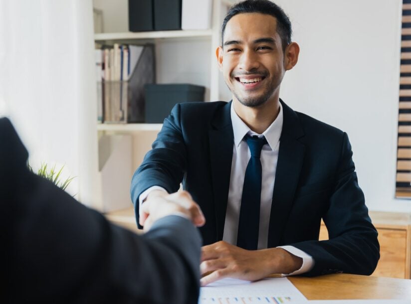 successful negotiate and handshake concept, two businessman shake hand with partner to celebration partnership and teamwork, business deal